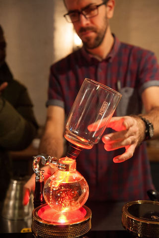 Mike inserting top chamber of siphon