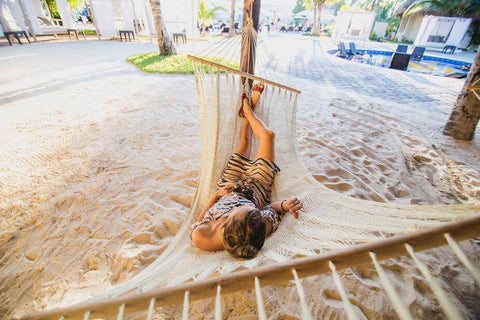 Woman on hammock on beach