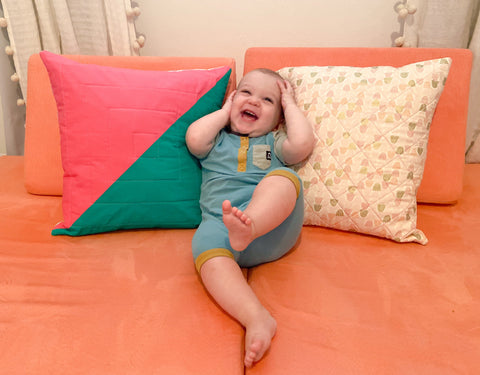 Baby Laying on Quilted Pillow Covers