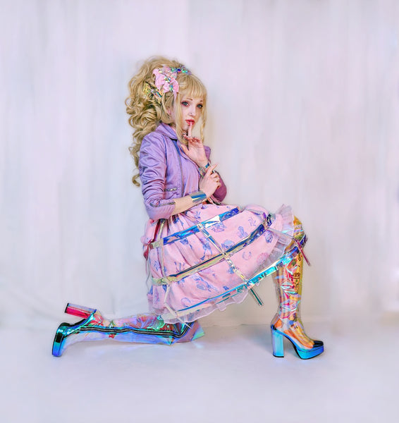 Katie Castles wearing a holographic lolita look.