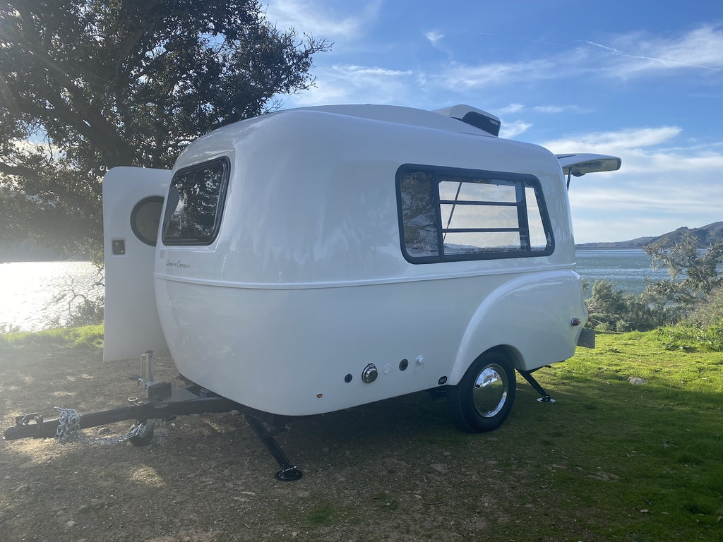 White HC1 parked by lake