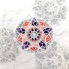Mandala stencil by April Sproule painted on fabric.