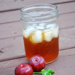 Plum tea in a mason jar