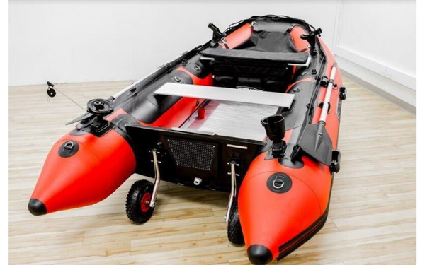 Red and black inflatable boat in showroom. 