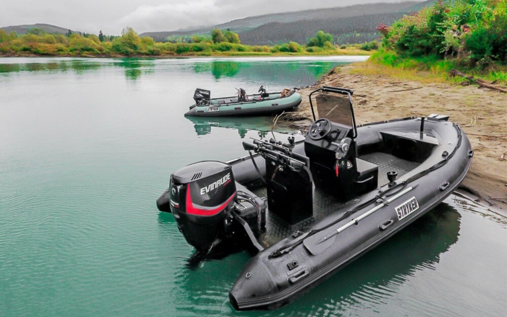 Two Stryker Inflatable Boats floating on a gorgeous lake. 