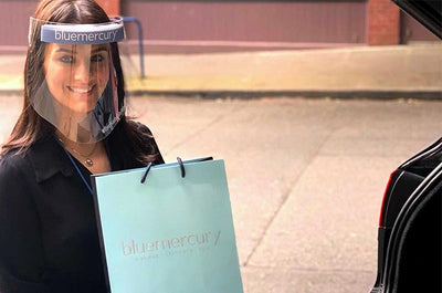 A Bluemercury Beauty Expert delivers a curbside pickup order