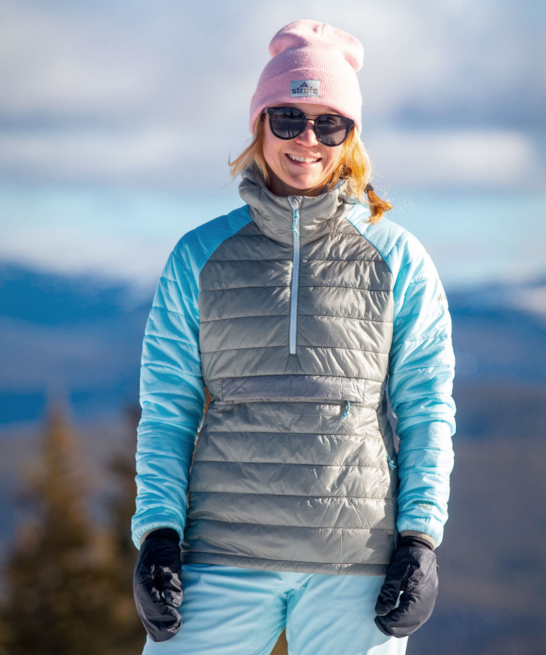 woman in aero pullover standing in snow