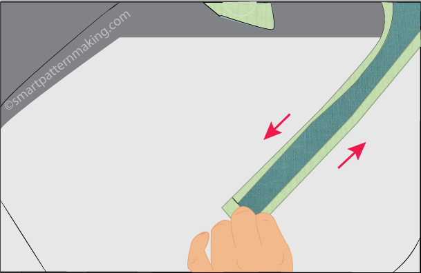 Step 8). Fold scrub cap tie in half then pin