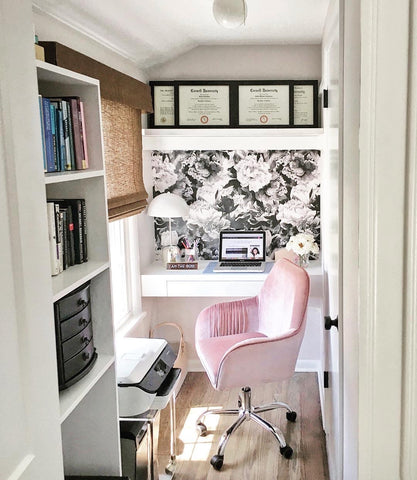 compact home office with floral wallpaper