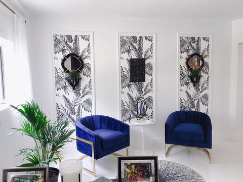 Black and white wallpaper panels against a white wall for a sophisticated home office vibe