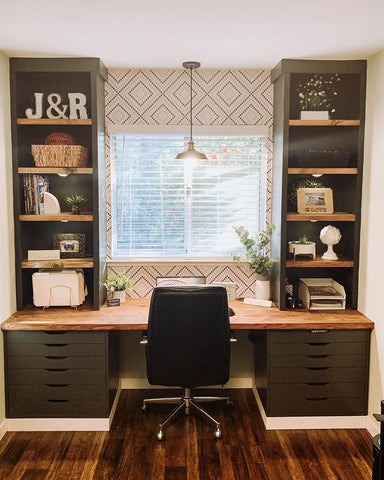 Olive green home office desk with an art-deco-inspired wallpaper