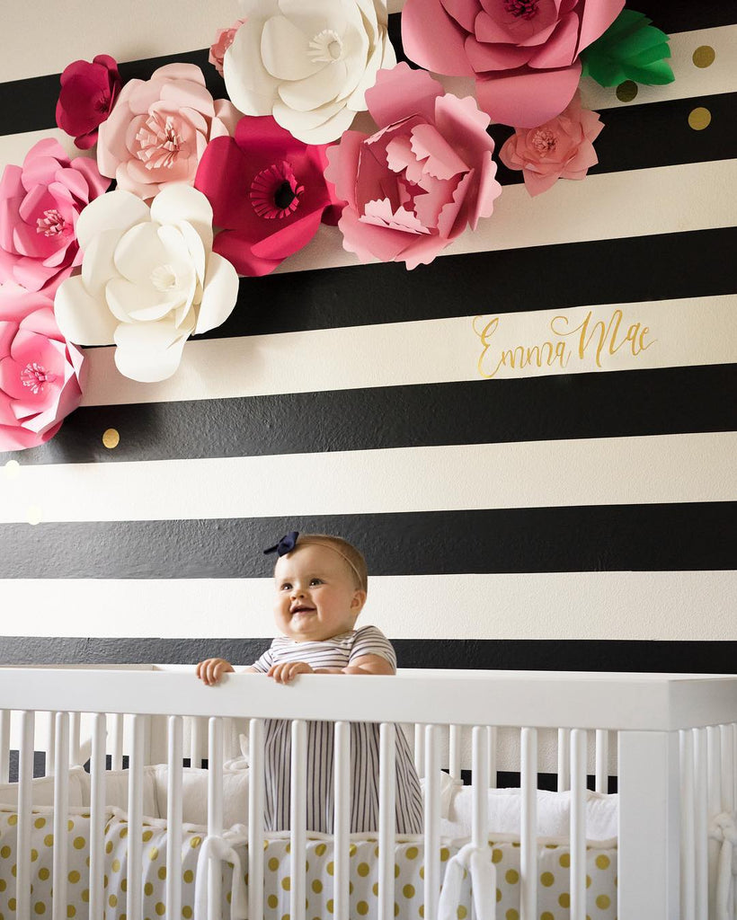 Bold black Easy Stripe wall decals by @wallsneedlove and paper flowers by Bloom Box