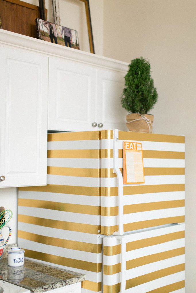 7 Unexpected Things to Stripe Using Easy Stripe by @wallsneedlove | DIY Gold Striped Fridge