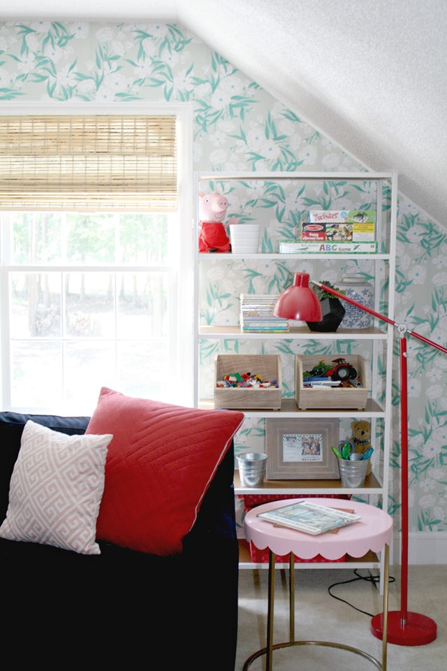 Emily A. Clark turned her kids' playroom into a chic, fun space using fun pops of color and removable wallpaper from @wallsneedlove.