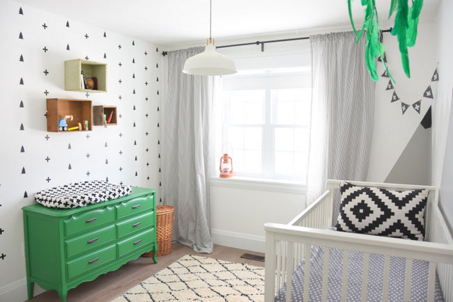 Modern Scandinavian inspired nursery using WallsNeedLove decals via The Sweetest Digs.