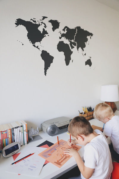 Merrick used WNL's World Map Vinyl Decal on her sons' bedroom wall and it's adorable.