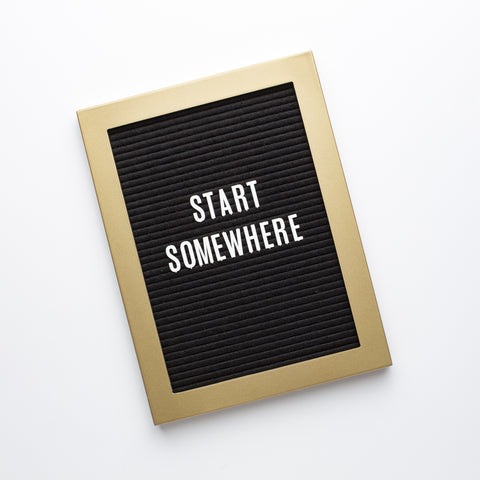 letterboard with "start somewhere" on it