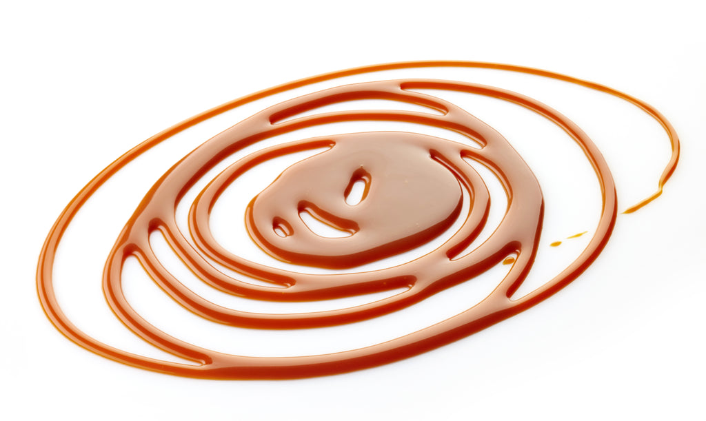caramel swirls on white background