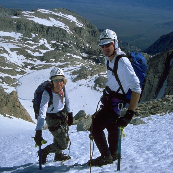 two climbers on a snow field with ice axes and crampons, mt. leConte, Sierra Nevada