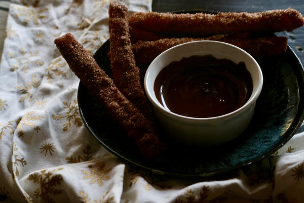 molé churros with chocolate