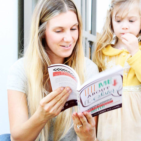 Mother reading book to daughter