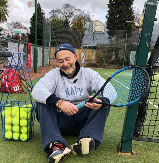 Nigel playing tennis