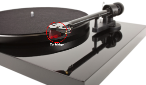 A close-up of the cartridge on a turntable