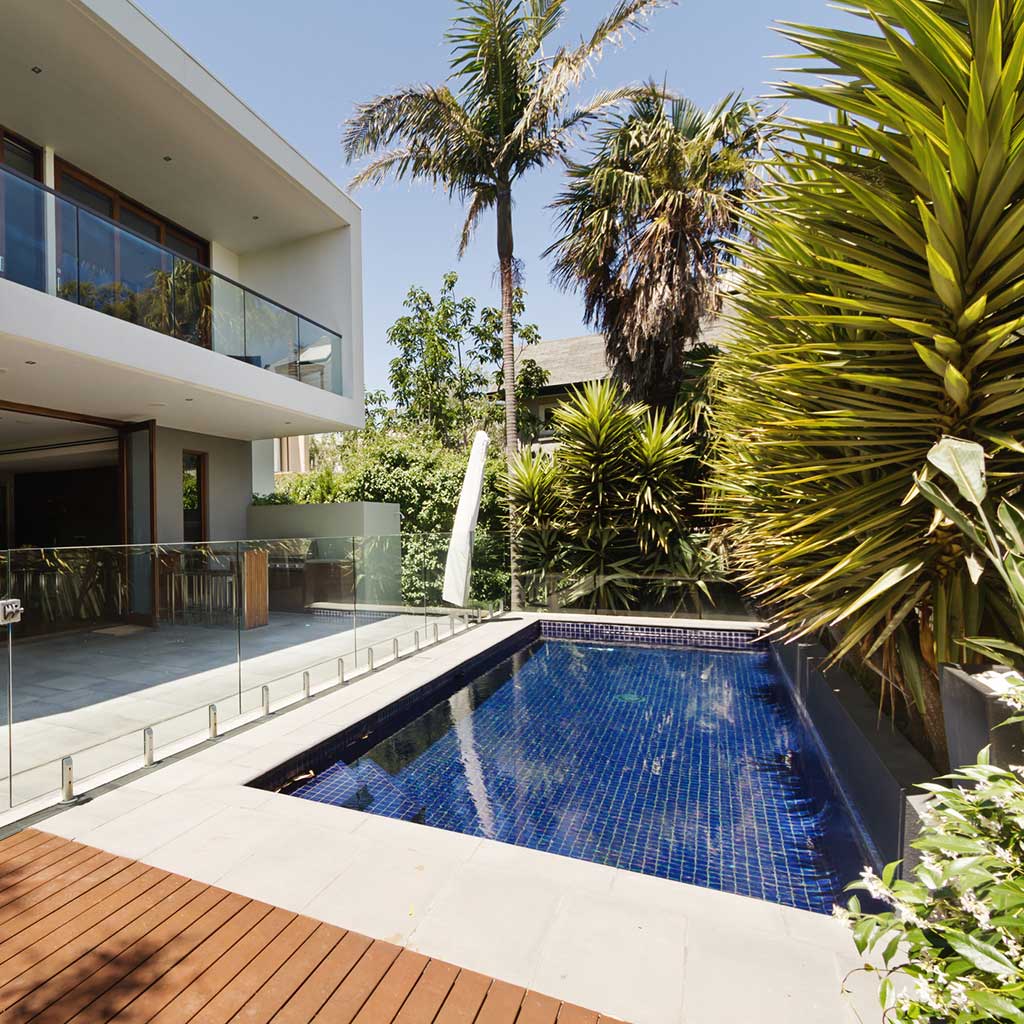 modern pool in a backyard of a house