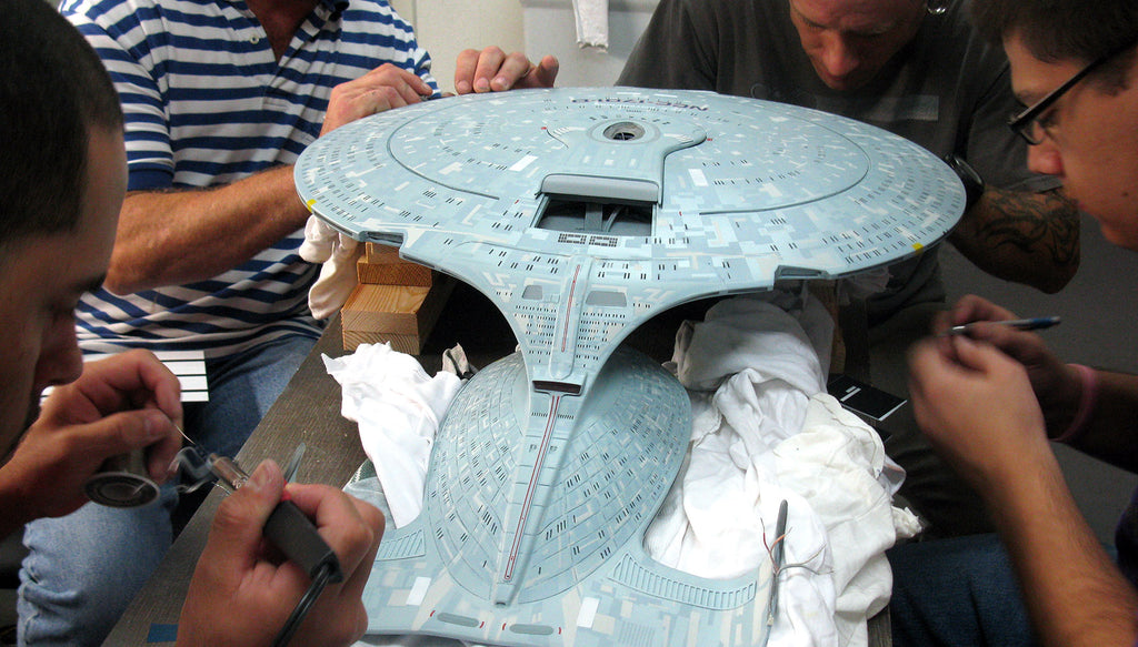 QMx FX Cinema Arts artisans work on an Enterprise D replica