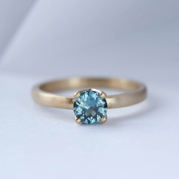 Teal Montana Sapphire Solitaire Engagement Ring in yellow gold 