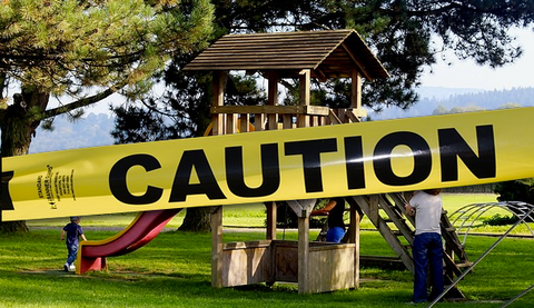 caution tape across a playground