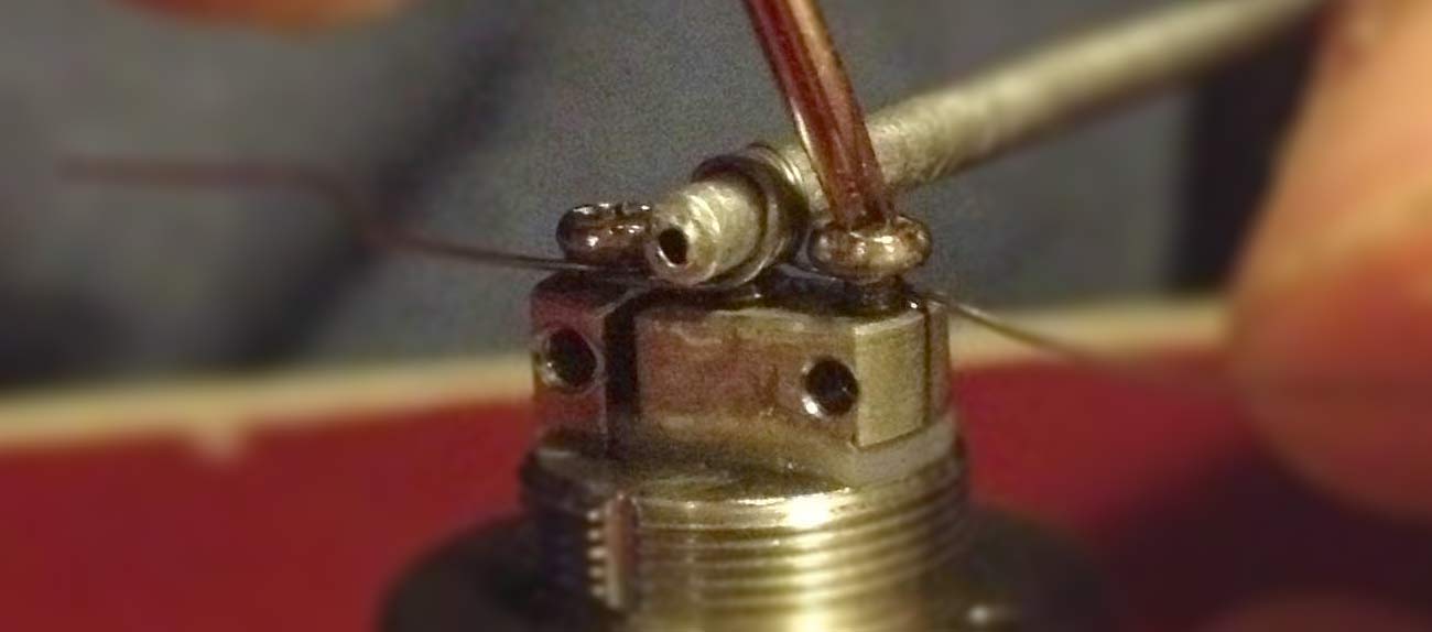 Rebuildable Atomizer with positive and negative leads attached.