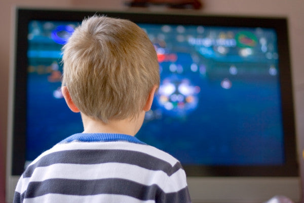 Small boy watching television — SaferOptics