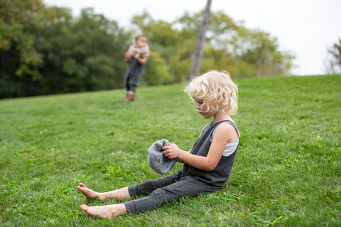 Toddler Dhotis Onesie on the grassy hillside