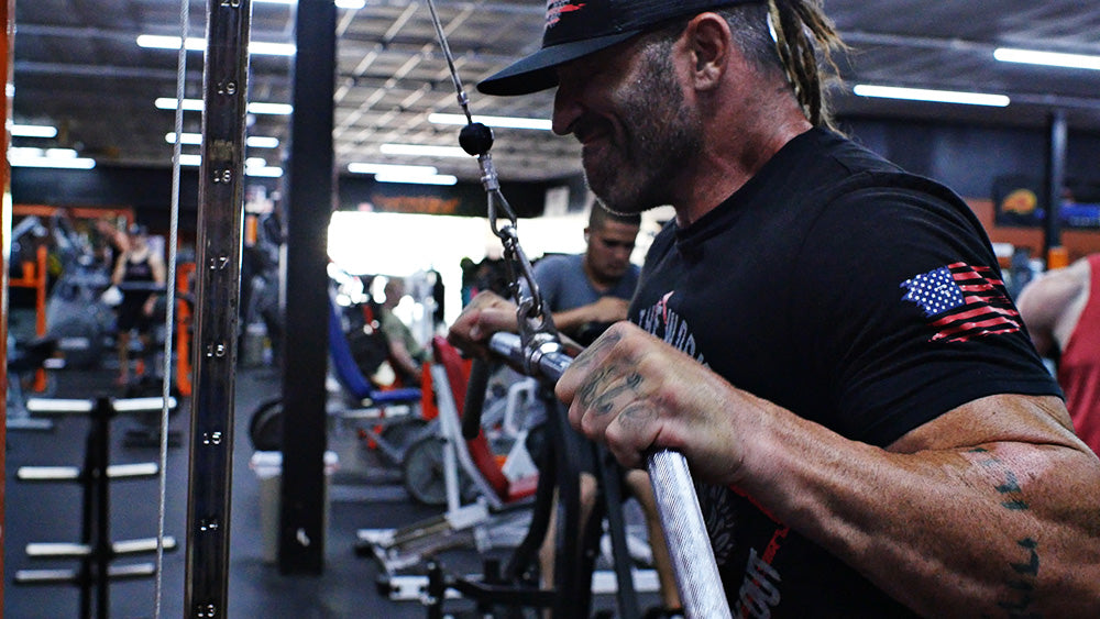 Wide grip triceps pushdowns with lat pulldown bar