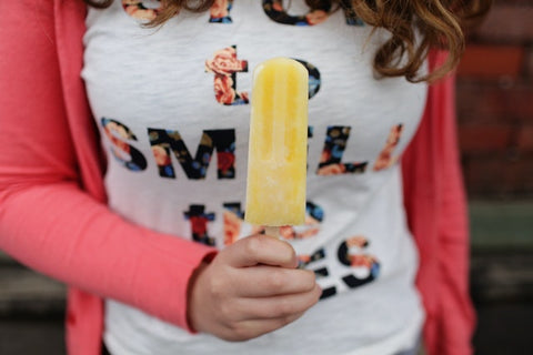 girl holding an ice pop