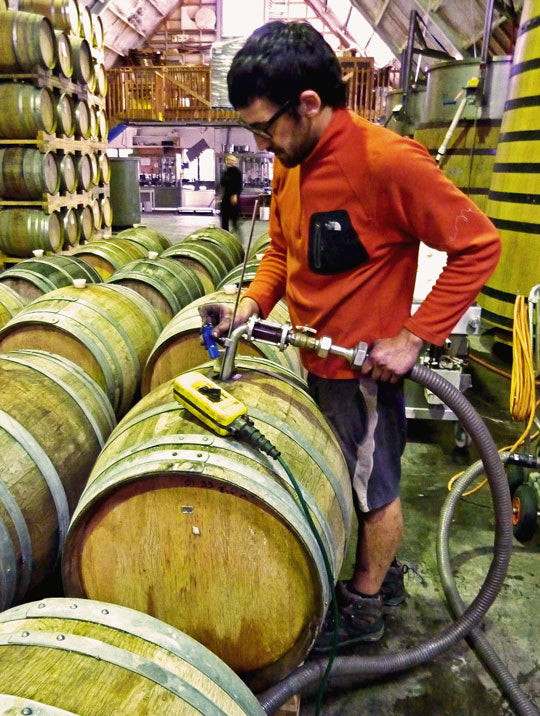 Filling a wine barrel at Pegasus Bay.