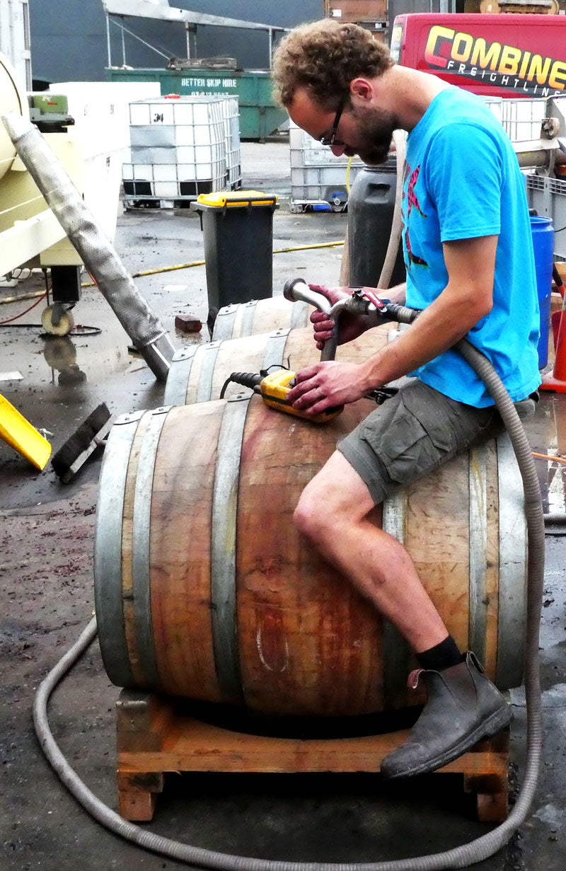 French winemaker François Robichon filling a barrel with 2016 red wine at Pegasus Bay