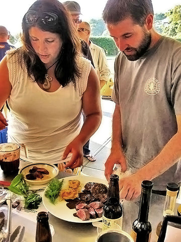 Winemaker Jannine and Haydon Good (winemaker from Crater Rim) prepare food at the Local Wild Food Challenge.