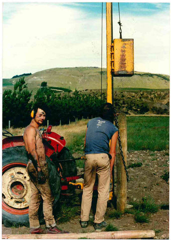 It was a hot summer day in 1988 when this photograph of Matthew Donaldson, now our winemaker, was taken, with Mount Cass (solid limestone) in the background. He is shown with a friend (Sean Harper – back to the camera) driving posts in the Pegasus Bay Vineyard during their secondary school holidays.