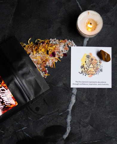 fire element intention candle with botanical bath soak for May hag swag sacred flame subscription box