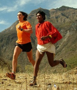 Tarahumara runner Arnulfo Quimare runs alongside ultra-runner Scott Jurek in Mexico's Copper Canyons