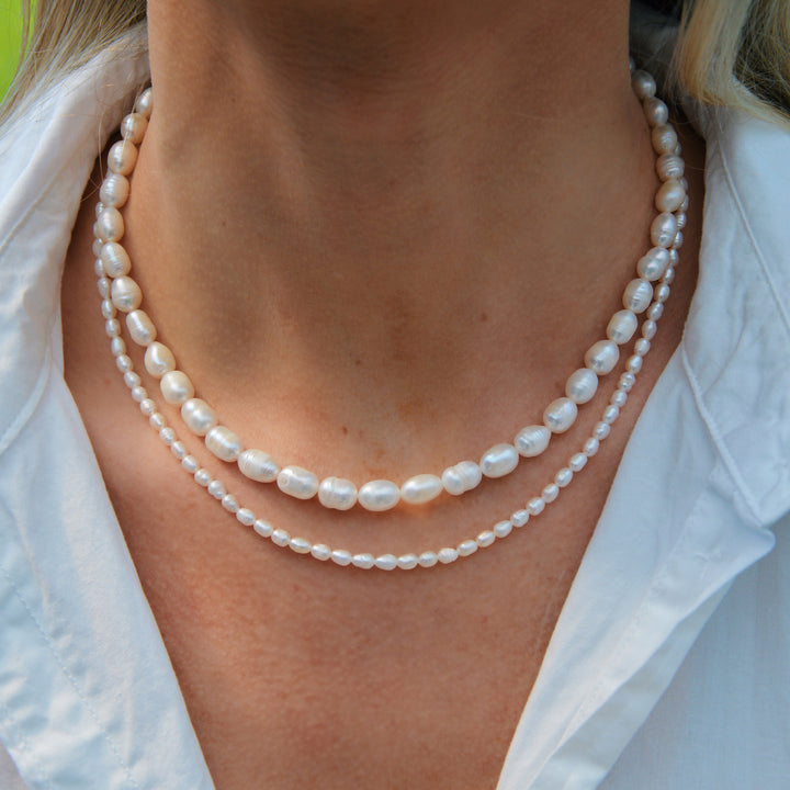 Køb smukke perlesmykker til kvinder | Stort udvalg i guld sølv → –