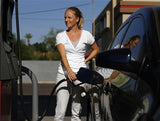 Woman adding Green Fuel Tabs and filling her tank