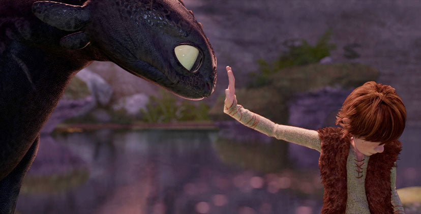 Hiccup touching Toothless for the first time