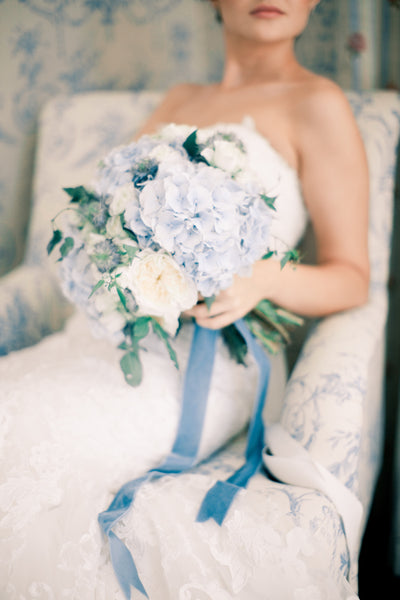 Bride with blue and white bouquet
