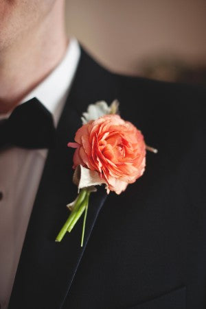 Groom with peach boutonniere