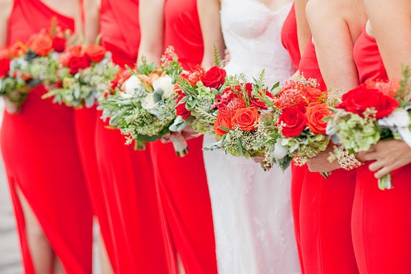 Bridesmaids in fiesta red dresses