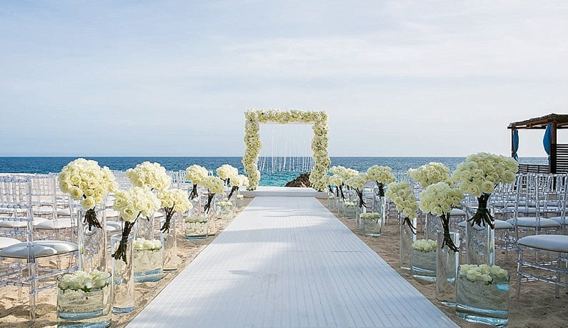 White wedding aisle at the beach