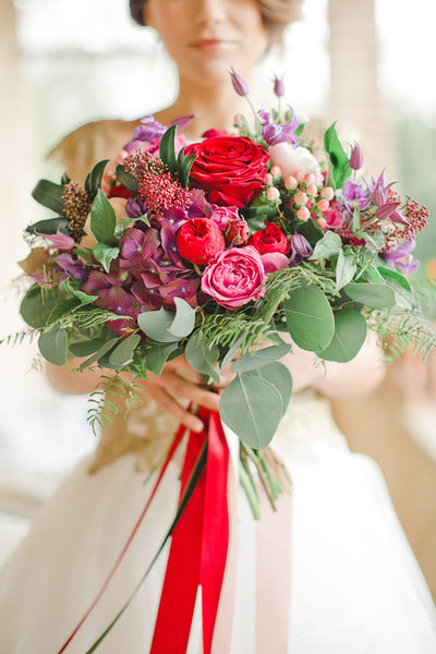 Colorful bouquet with red ribbon